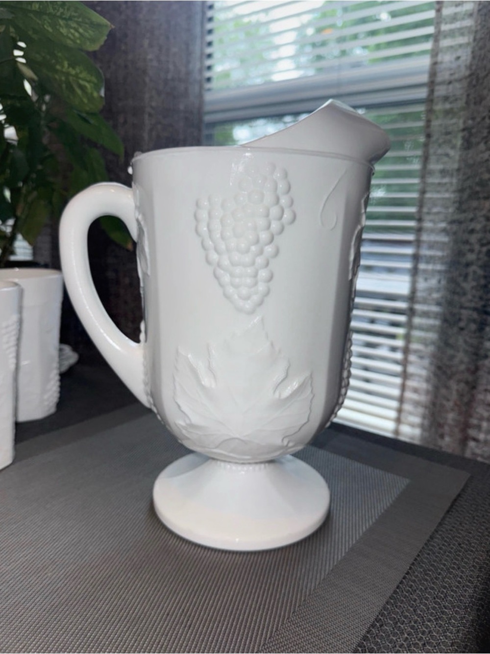 Vintage Indiana Glass Company pitcher in the "Colony Harvest Grape" pattern.